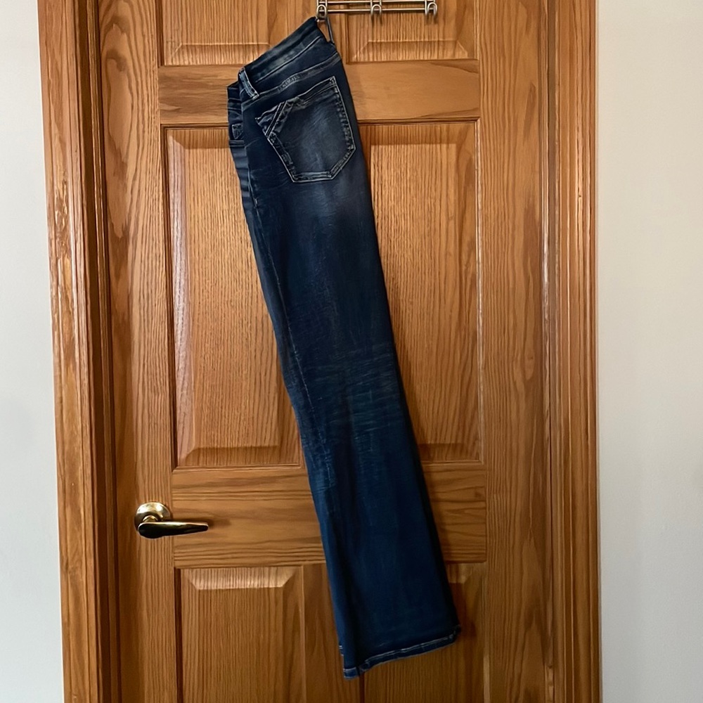 Buckle Black Boot Cut jeans. Darkish wash